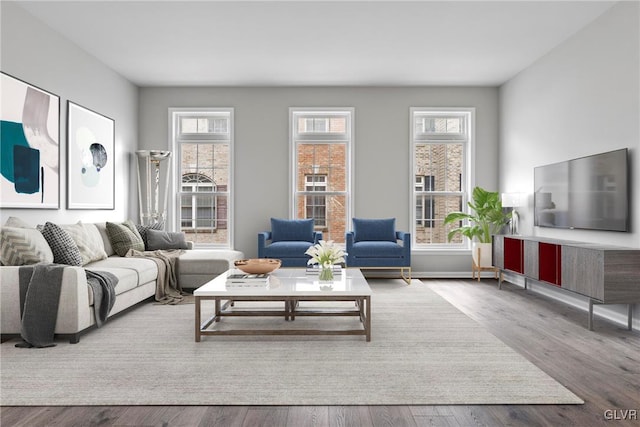 living room featuring hardwood / wood-style flooring and a healthy amount of sunlight