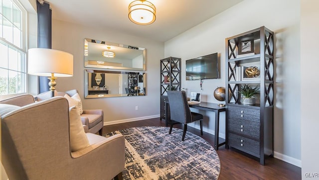 home office with dark wood-type flooring