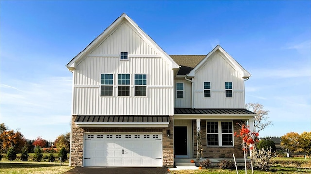 modern farmhouse style home featuring a garage and a front lawn