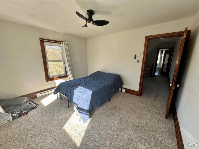 bedroom with carpet floors, a baseboard radiator, and ceiling fan