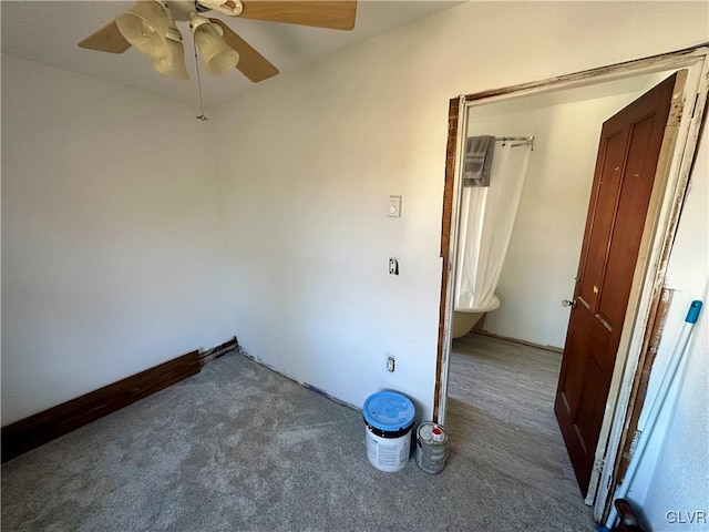 carpeted empty room with ceiling fan