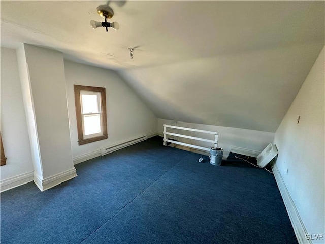 bonus room with lofted ceiling, dark carpet, and baseboard heating