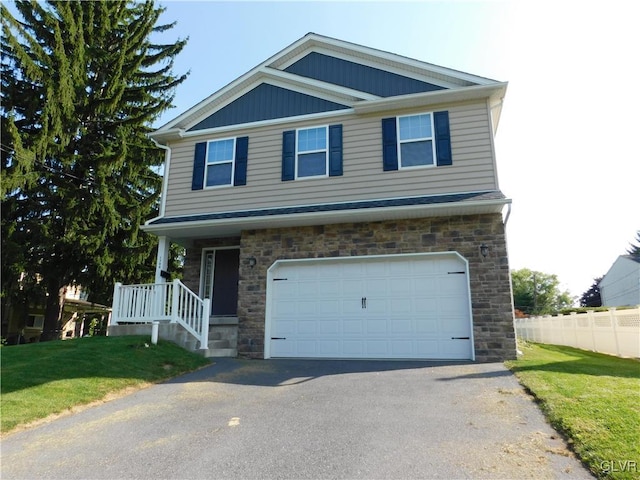 view of front facade with a front yard and a garage