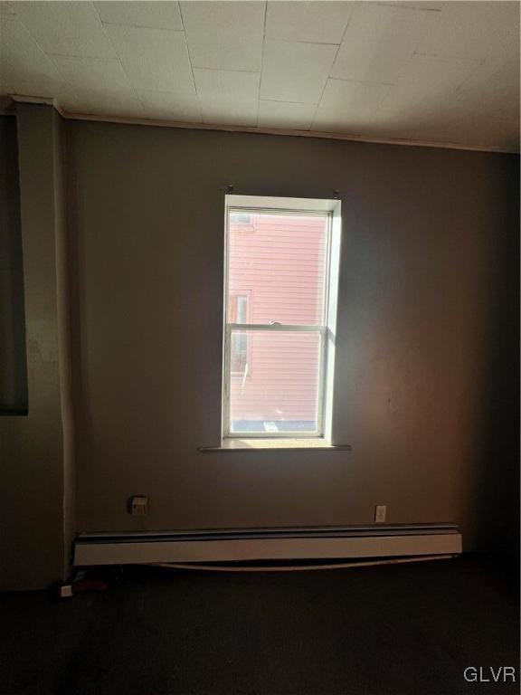 spare room with a baseboard radiator