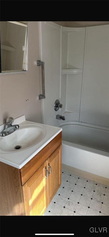 bathroom with vanity and tub / shower combination