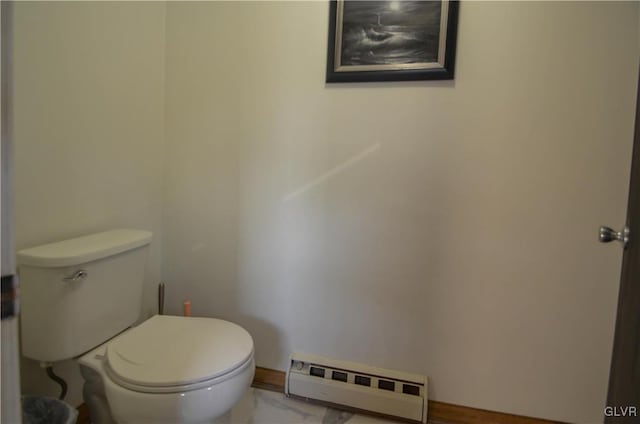 bathroom with toilet and a baseboard heating unit