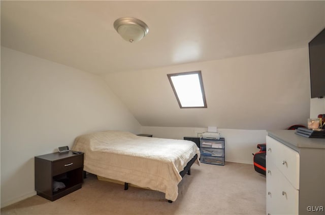 carpeted bedroom with vaulted ceiling