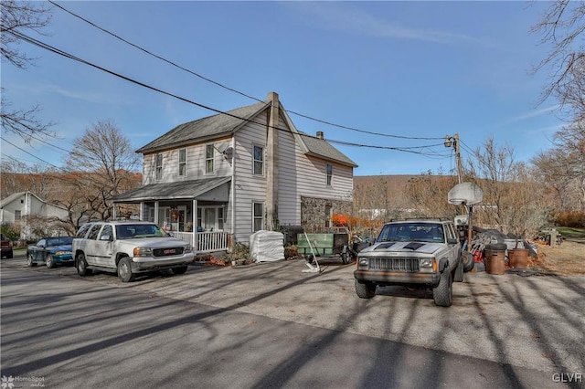 view of property exterior with a porch