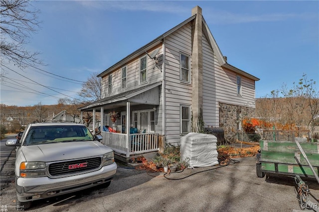 view of property exterior featuring a porch