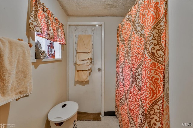 bathroom with a textured ceiling