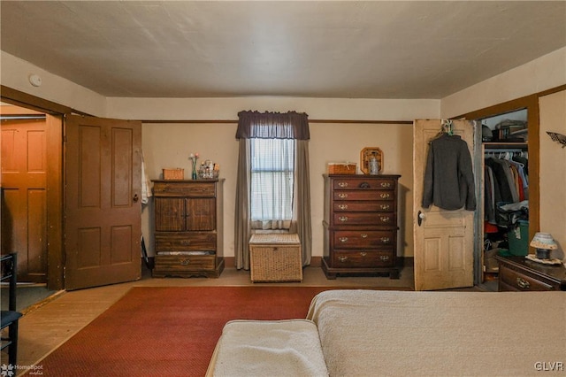 bedroom featuring a closet and hardwood / wood-style floors