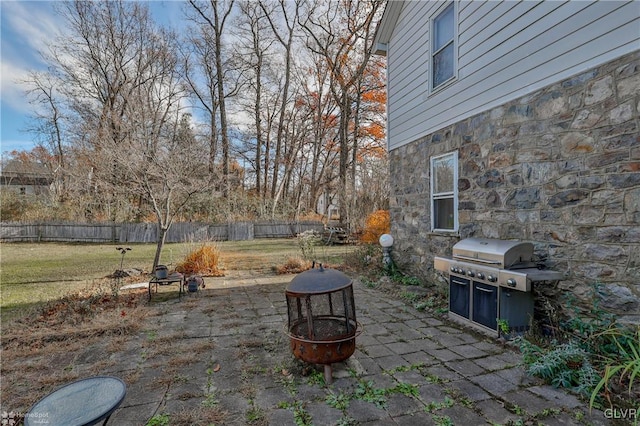 view of patio with a fire pit and grilling area