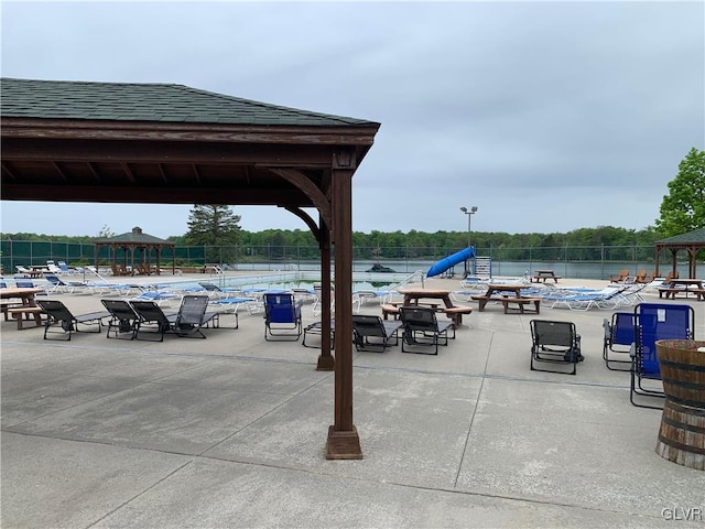 view of home's community with a gazebo and a water view