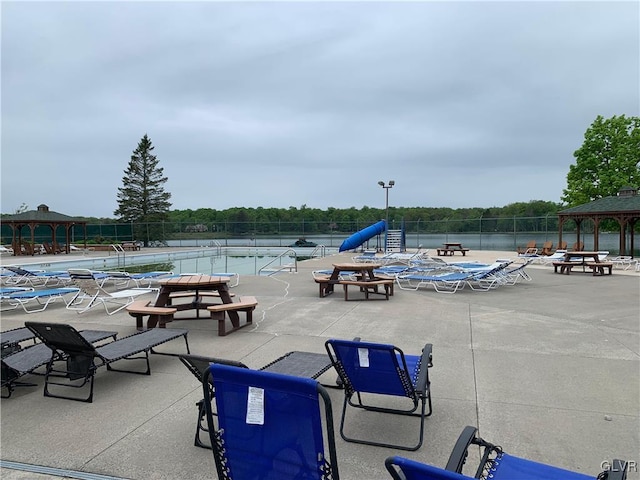 view of pool featuring a gazebo and tennis court