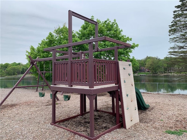 view of jungle gym featuring a water view