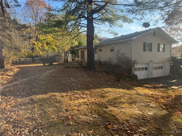 view of side of property featuring a garage