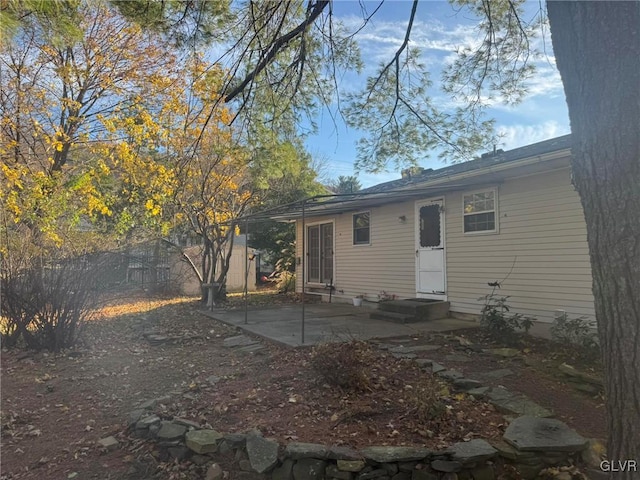 rear view of property featuring a patio