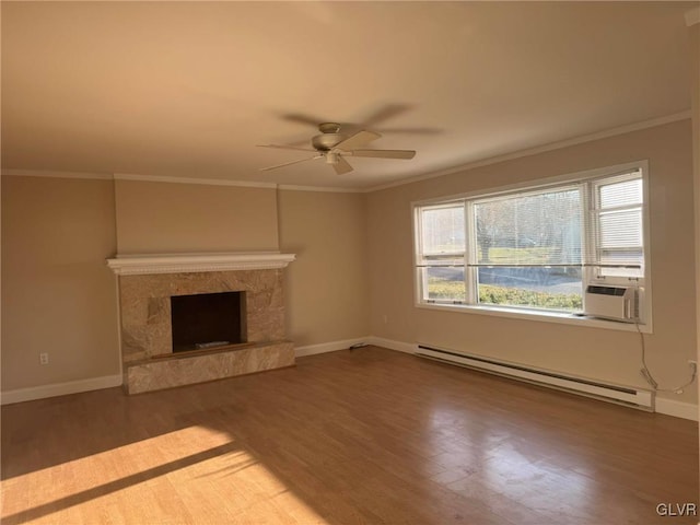 unfurnished living room featuring ceiling fan, a baseboard radiator, cooling unit, wood-type flooring, and ornamental molding