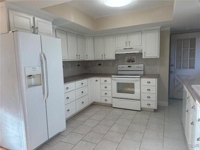 kitchen with white cabinets, white appliances, and backsplash