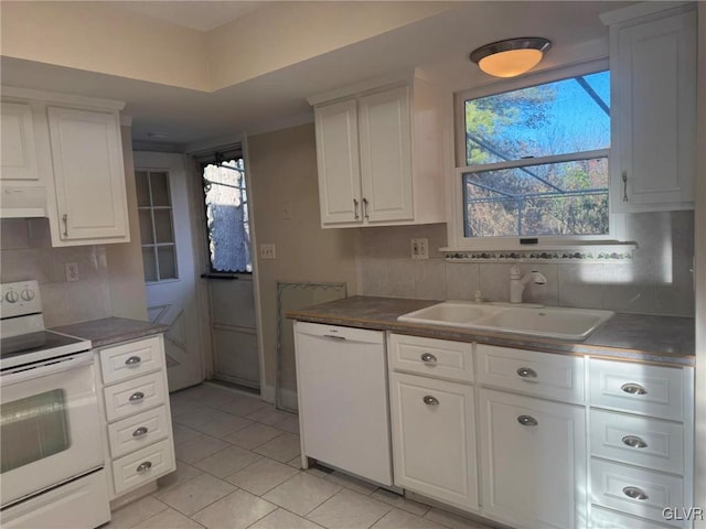 kitchen featuring white appliances, white cabinets, ventilation hood, sink, and decorative backsplash