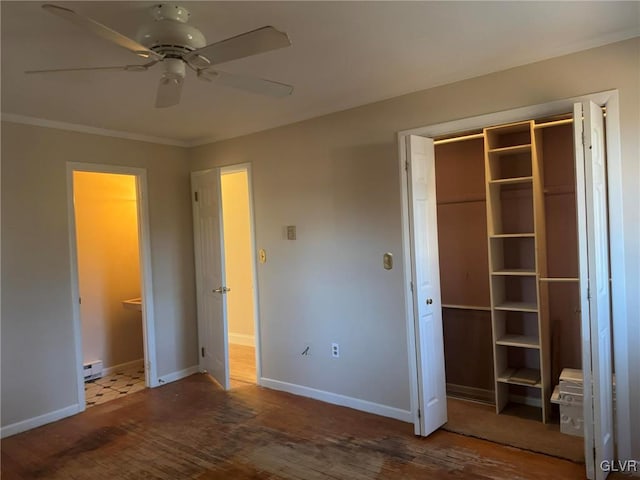 unfurnished bedroom featuring ceiling fan, crown molding, wood-type flooring, and a baseboard radiator