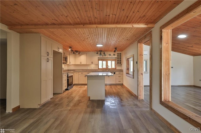 kitchen featuring wood ceiling, stainless steel appliances, hardwood / wood-style flooring, white cabinets, and a center island