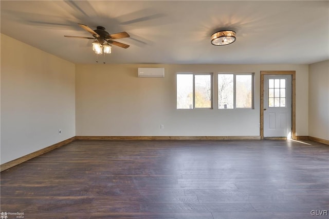 unfurnished room featuring dark hardwood / wood-style floors, ceiling fan, and a wall unit AC