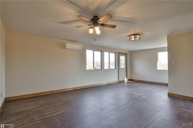 unfurnished room with dark hardwood / wood-style flooring, an AC wall unit, and ceiling fan