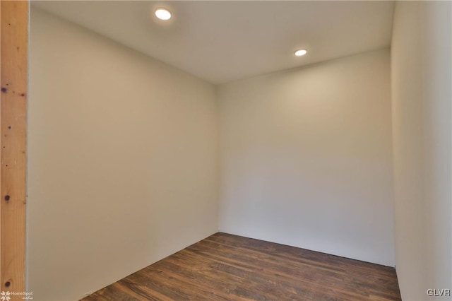 spare room with dark hardwood / wood-style floors