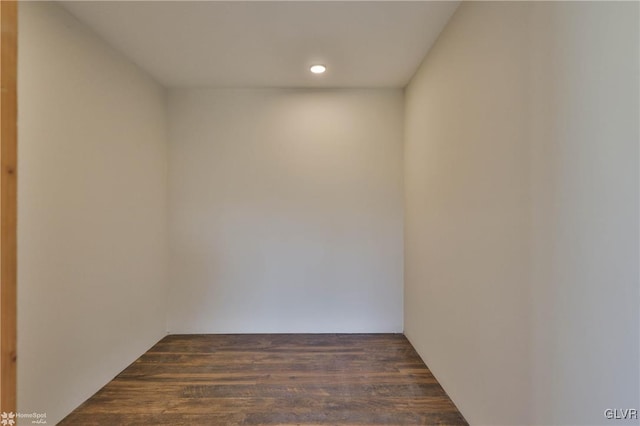 empty room with dark wood-type flooring