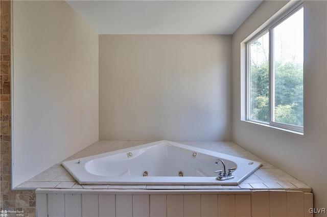 bathroom featuring a relaxing tiled tub