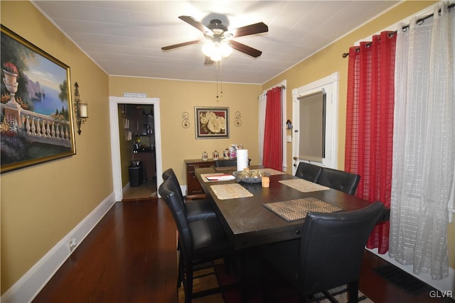 dining area with hardwood / wood-style floors and ceiling fan