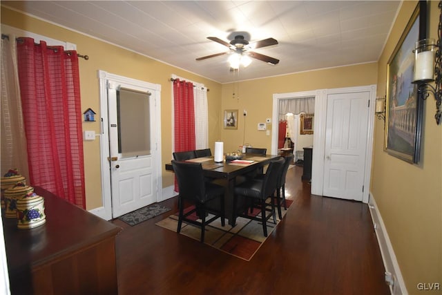 dining area featuring ceiling fan and dark hardwood / wood-style floors