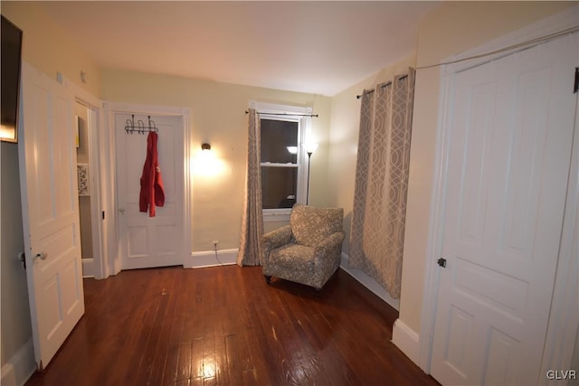 unfurnished room with dark wood-type flooring