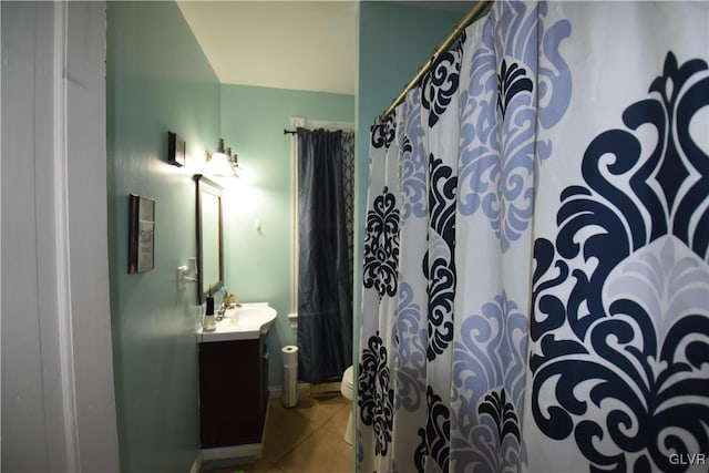 bathroom featuring tile patterned flooring and vanity