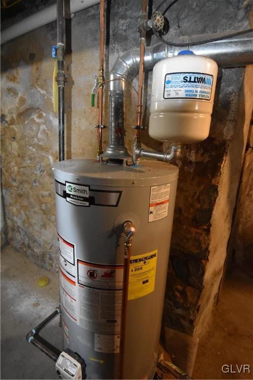 utility room featuring water heater