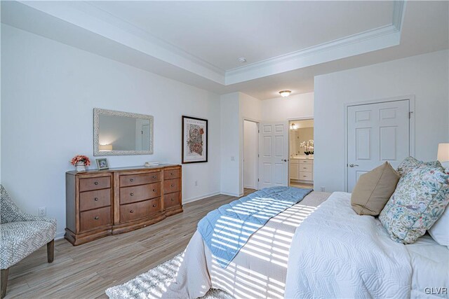 3855 Victors Way, Bethlehem Twp, PA 18045 - bedroom with ornamental molding, ensuite bathroom, a tray ceiling, and light hardwood / wood-style floors