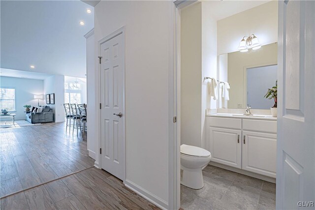3855 Victors Way, Bethlehem Twp, PA 18045 - bathroom featuring vanity, wood-type flooring, and toilet