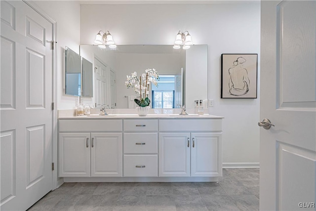 bathroom featuring tile patterned flooring and vanity