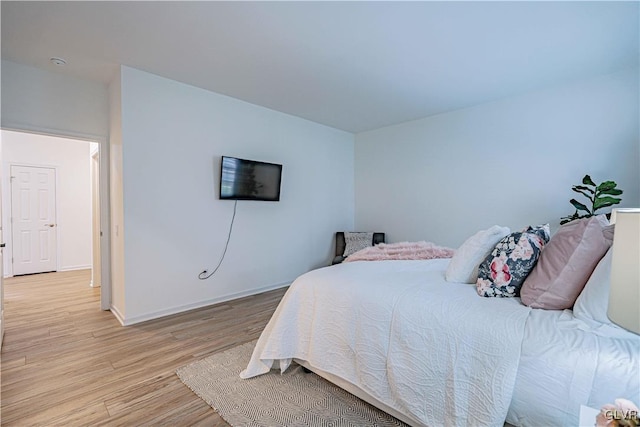 bedroom with light wood-type flooring