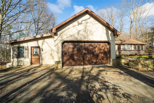 view of front facade with a deck and a garage