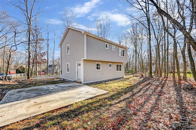 back of house with a patio