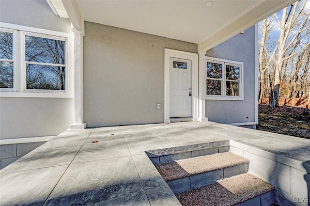 property entrance with a patio