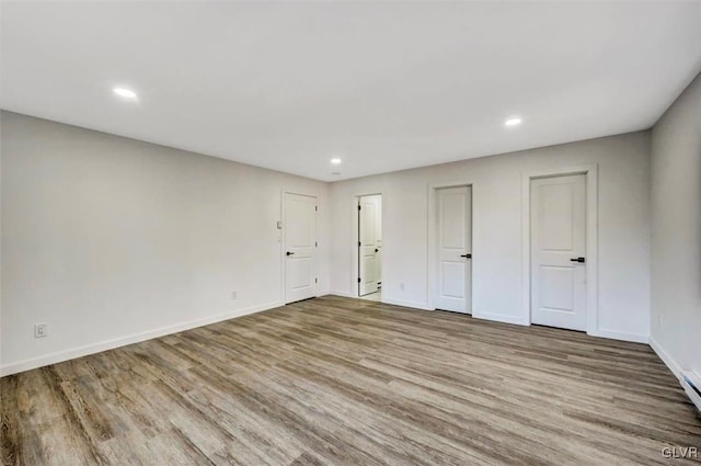 unfurnished bedroom with light wood-type flooring