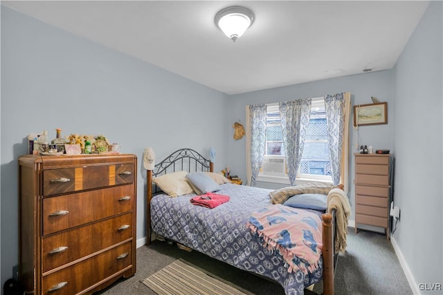 bedroom featuring dark carpet