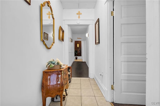 hall with light tile patterned flooring