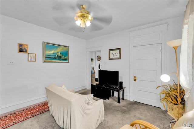 living room featuring ceiling fan and light colored carpet