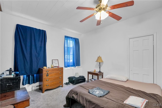 carpeted bedroom featuring ceiling fan