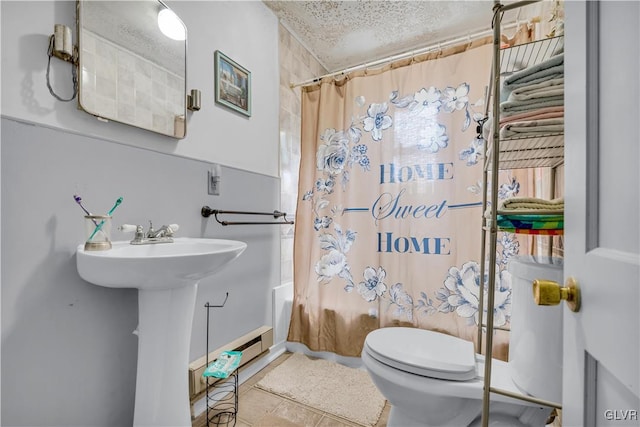 bathroom featuring shower / bath combo, a textured ceiling, and toilet