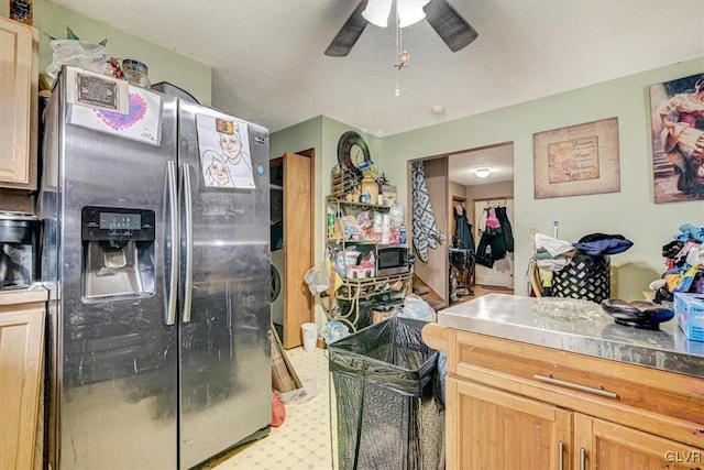 kitchen featuring washer / clothes dryer, stainless steel fridge, light brown cabinets, and ceiling fan